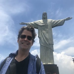 Photograph of Rick Farrell standing in front of Cristo del Pacifico