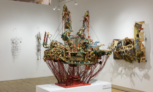 Photograph of sculptures by Emergy Blagdon, Kevin Sampson and Lonnie Holley on exhibition in the front gallery of Intuit