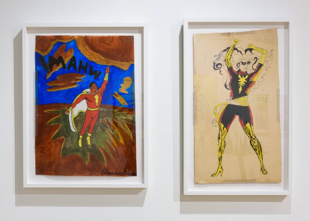 Photograph of two two-dimensional mixed media pieces by Charles Williams, depicting superheroes