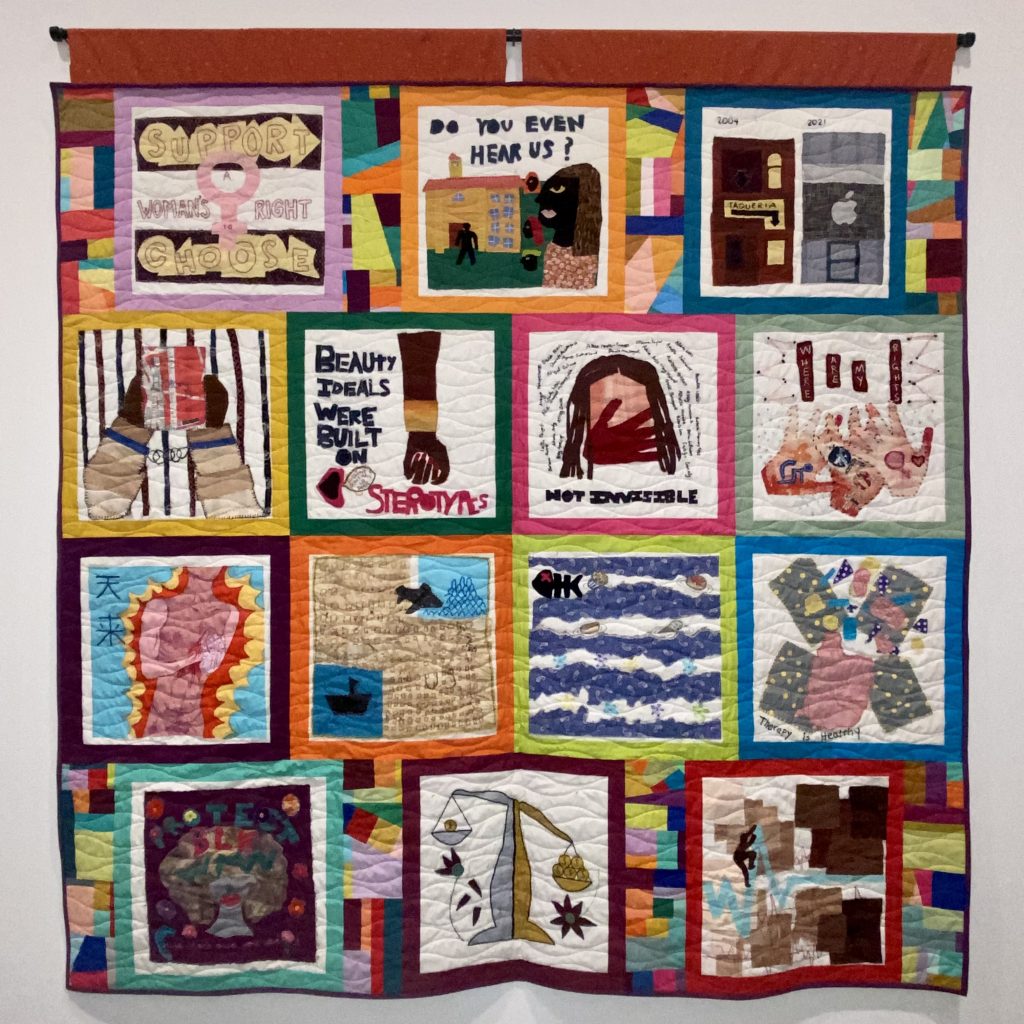 Quilt with 14 blocks, designed by the 2021 cohort of IntuiTeens