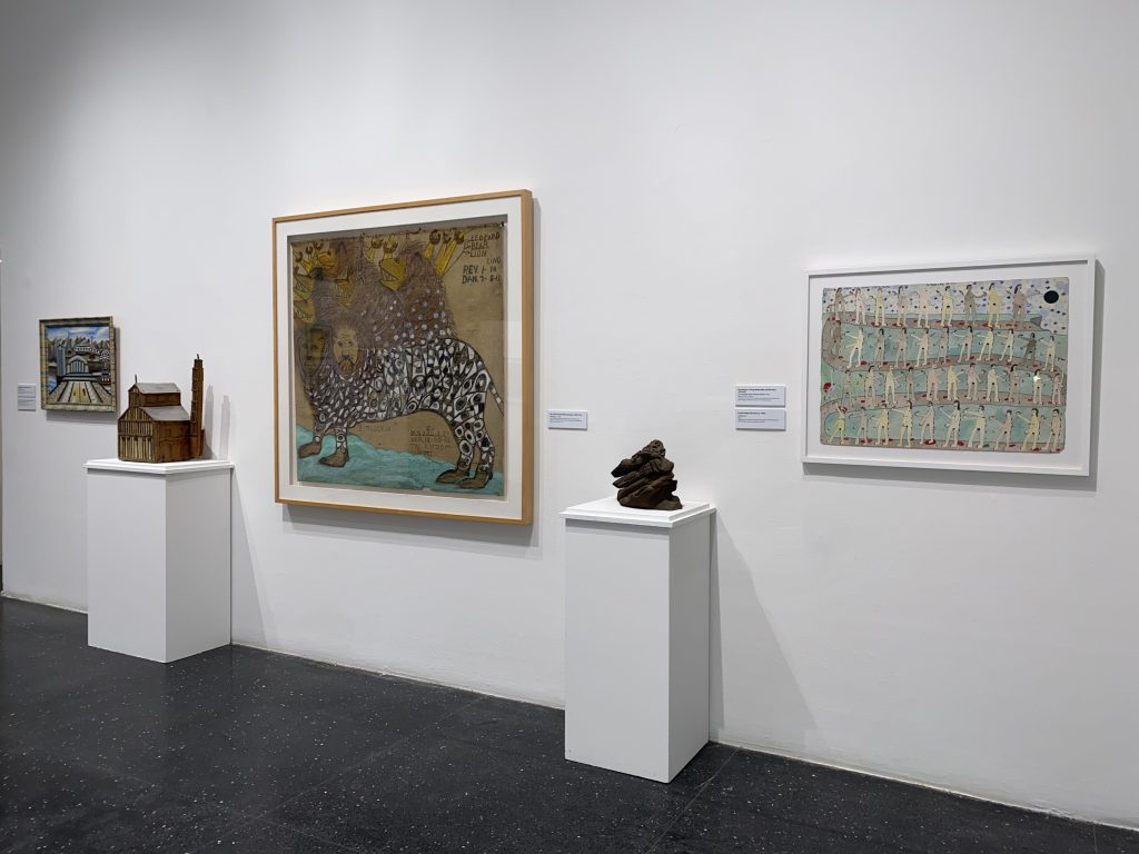 Installation photo of works of art from Intuit's collection displayed on white pedestals and walls